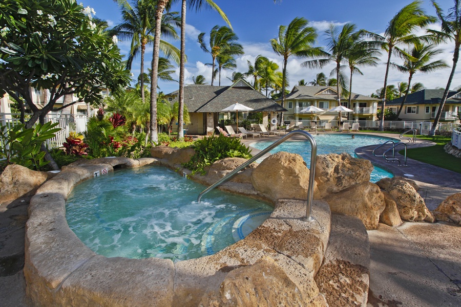 Soak in the hot tub surrounded by rock features and swaying palms.
