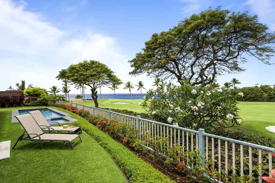 Grab the shade of the monkeypod, loungers out and the fairway just past the fence.