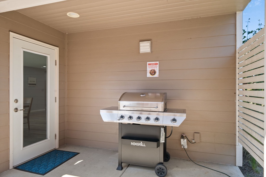 Enjoy outdoor dining and easy summer evenings with the private BBQ area tucked beside the sunny backyard patio.