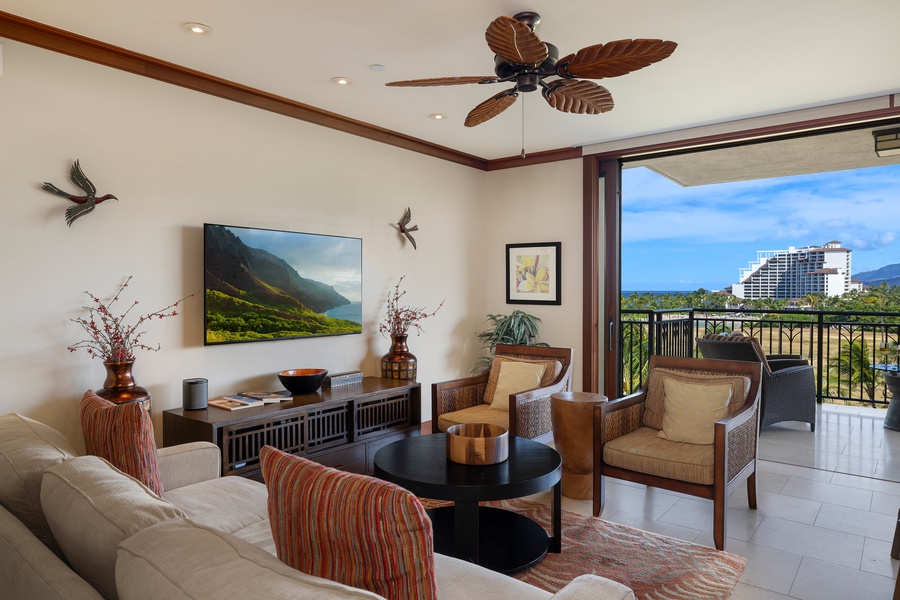 Sink into the plush couch and breathe in the refreshing island breezes in this inviting Hawaii paradise.