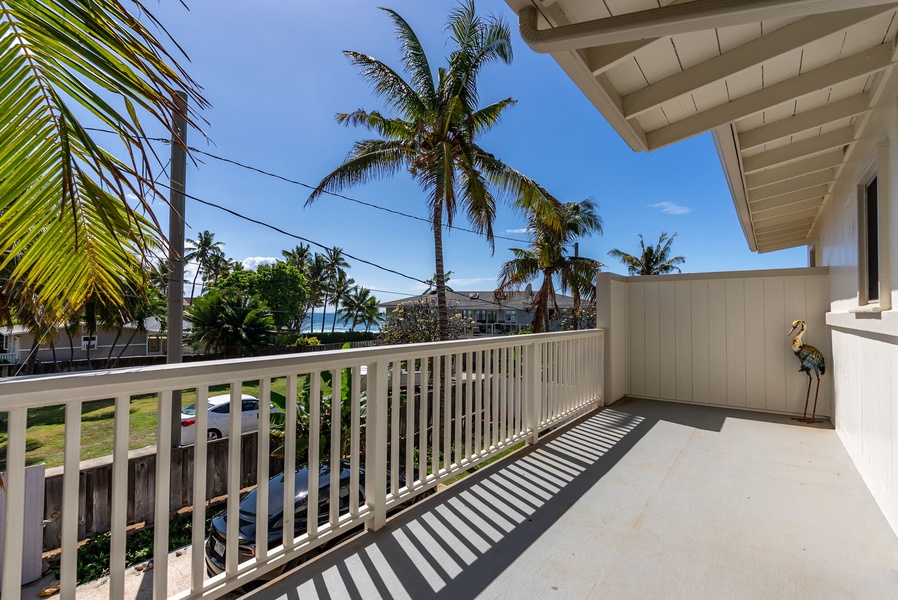 Lanai corner with palm tree views, perfect for soaking in sunny mornings.