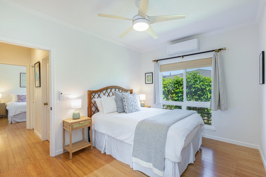 Cozy queen guest room with ceiling fan and A/C.