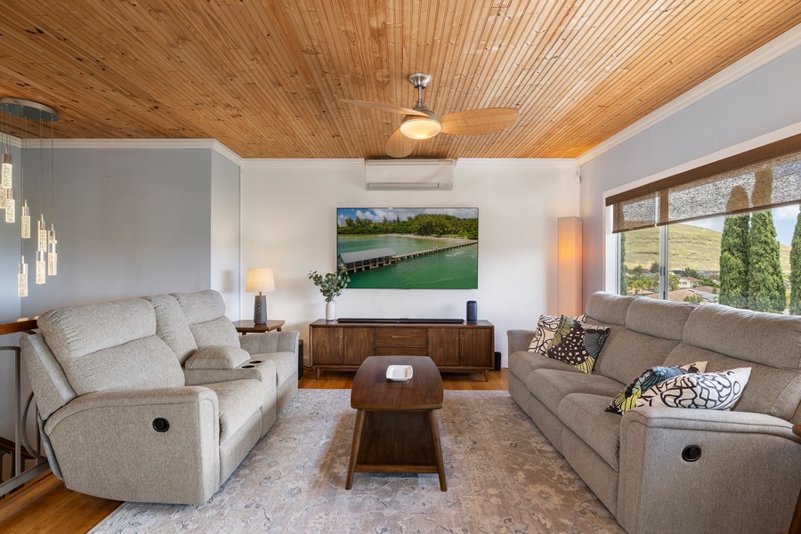 Natural light and coastal-inspired decor make the living room an inviting space for connection, relaxation, or streaming your favorite shows.