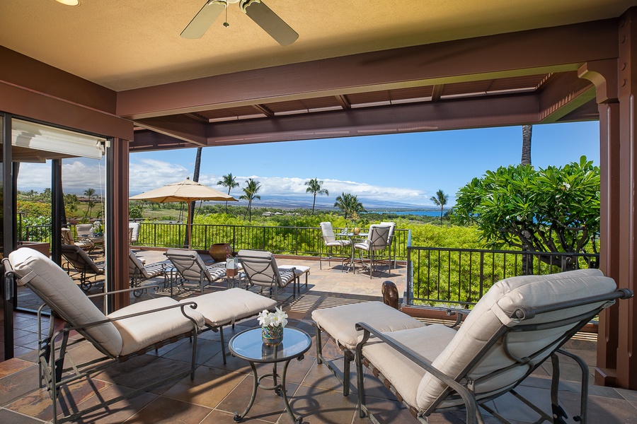 Unwind on the private lanai with plush loungers and panoramic ocean views.