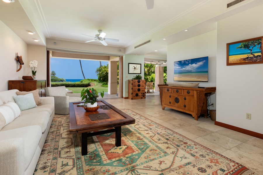 Take it slow while ocean breezes flow through your open-air living room, where tropical views create your perfect island retreat.