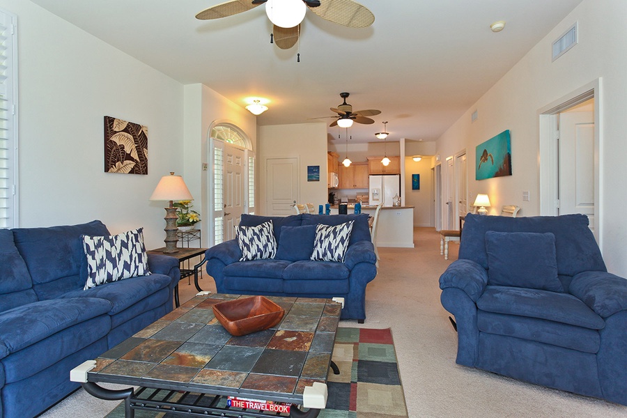 Sink into the plush seating in the living area surrounded by vibrant colors.