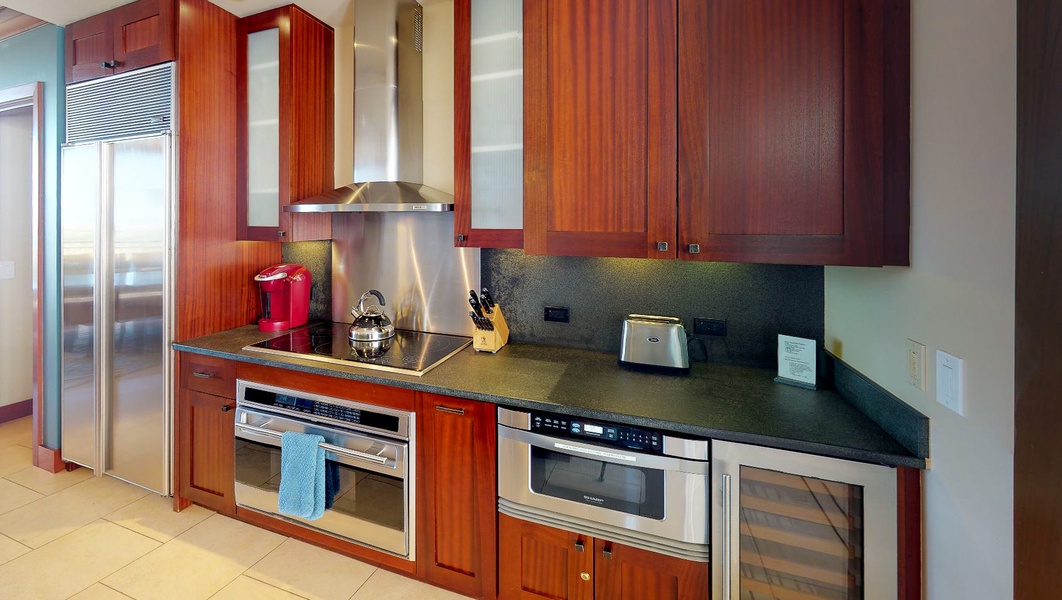 Enjoy a fully equipped kitchen with wine fridge and stainless steel appliances.