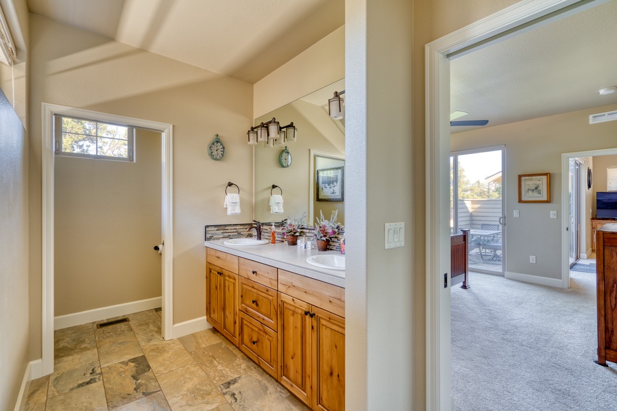 The spacious and well-appointed ensuite bathroom, seamlessly connected to the primary bedroom for your comfort and ease