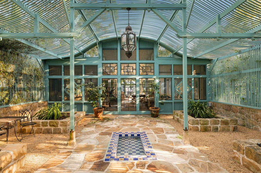 Step into your private conservatory where natural light filters through elegant glass walls, creating a serene garden sanctuary perfect for morning coffee or quiet contemplation.