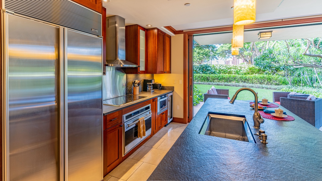 The kitchen is every chef's dream with stainless steel appliances and ocean breezes from the lanai.