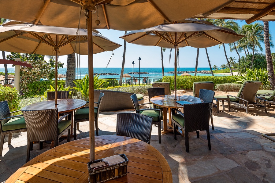 Palm trees and aqua blue seas at the resort dining area.