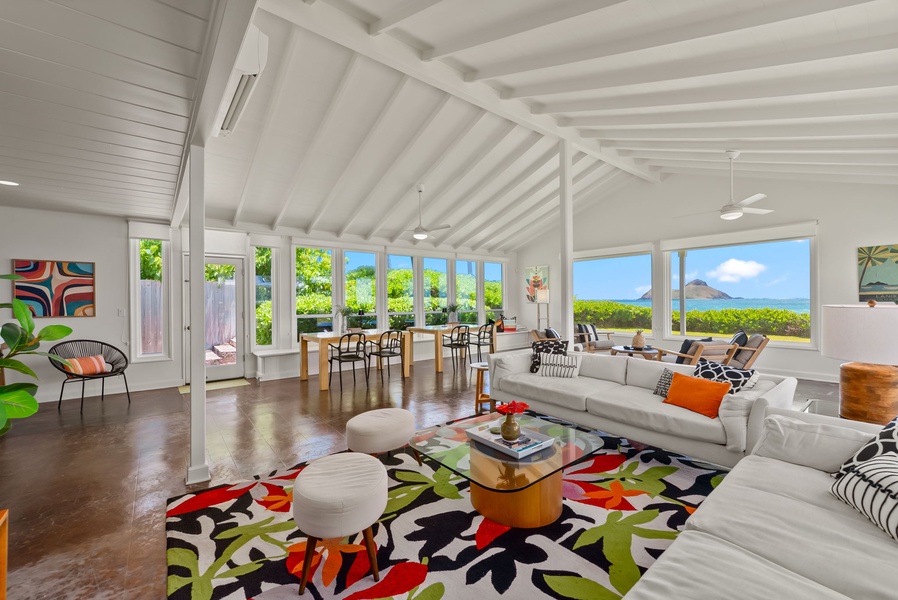 Gather with loved ones in this open-concept space steps from the sea.