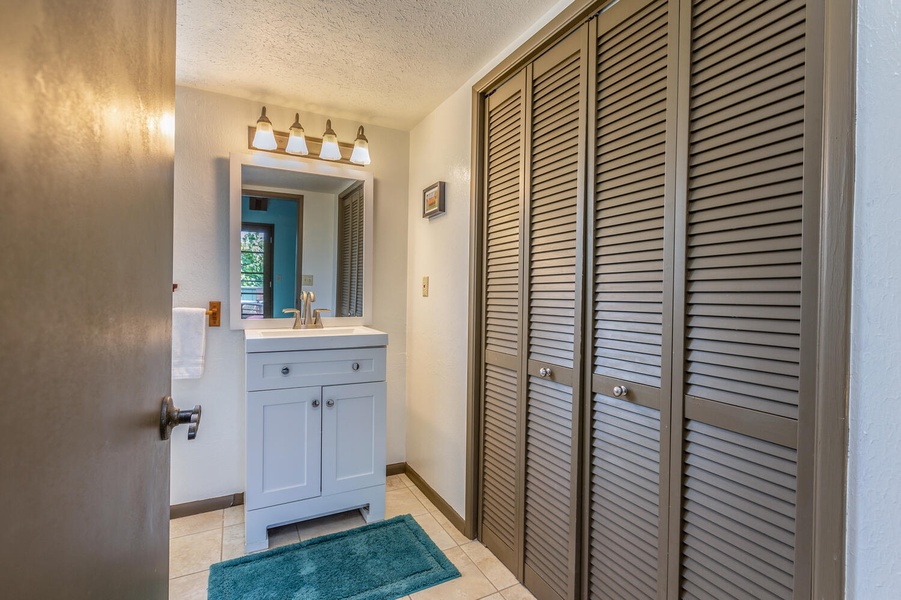 Loft full bathroom with tile shower