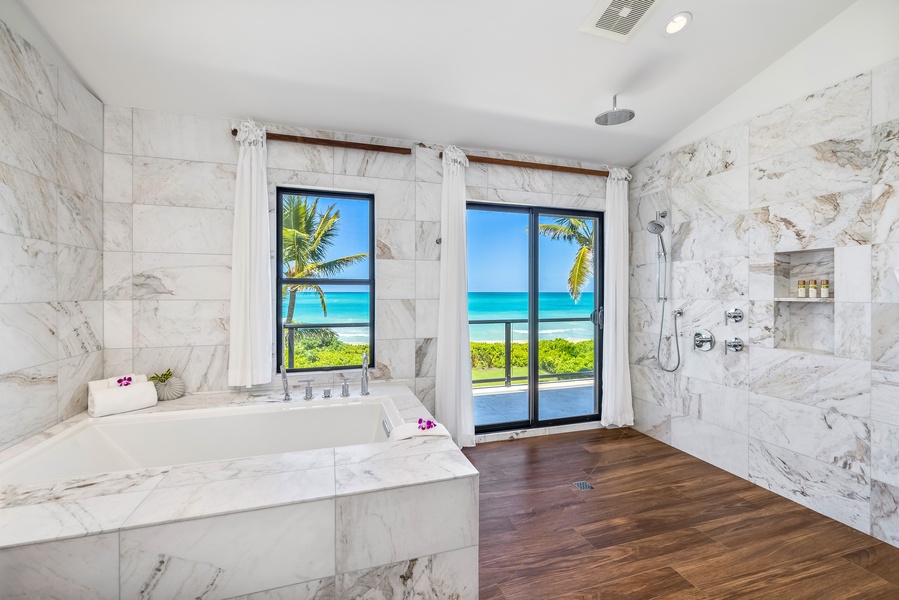 Take a relaxing bath in the soaking tub with views of the beach just through the window