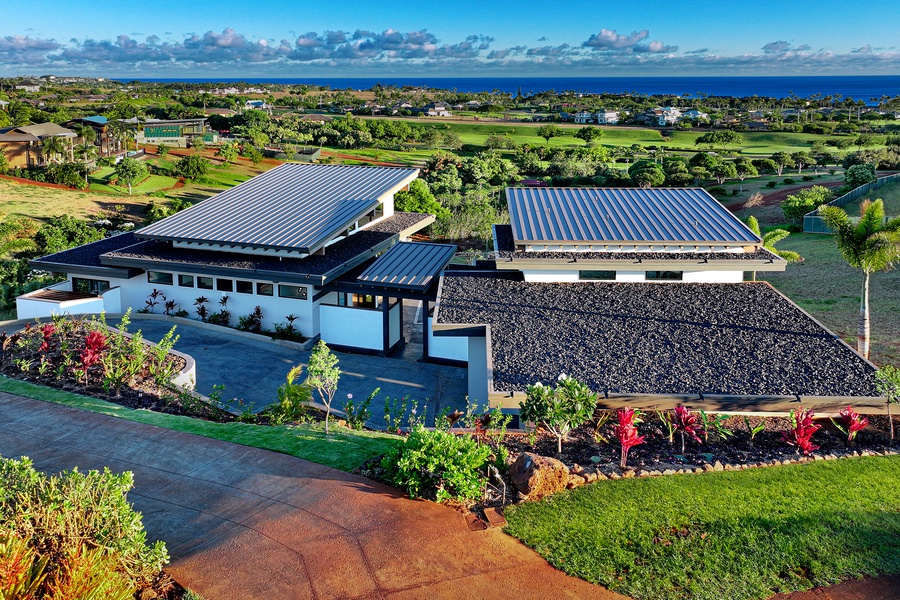 Take in the aerial views that overlook the exclusive Kukui'ula golf course, where lush greens meet azure skies.