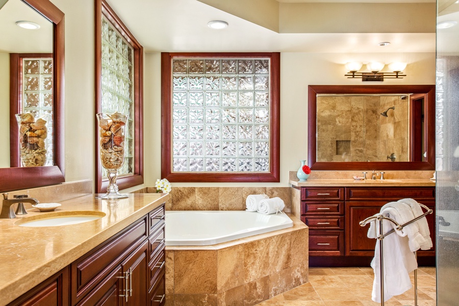 Elegant guest bath with deep soaking tub and marble detailing — designed for pure comfort.