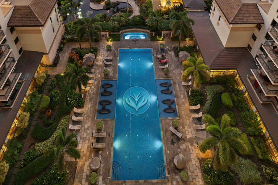 Views of the lap pool with sun loungers
