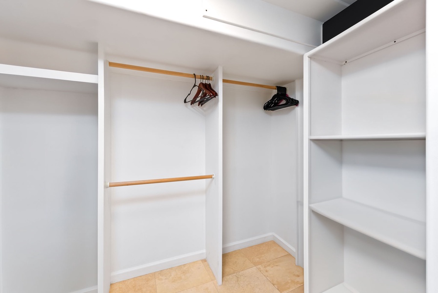 Walk-in closet with ample storage and shelving, perfect for keeping your belongings organized during an extended stay