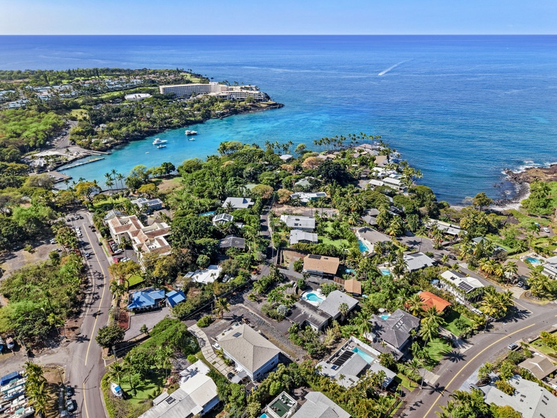 Stunning aerial view of oceanfront community with pristine turquoise waters and tropical landscape.
