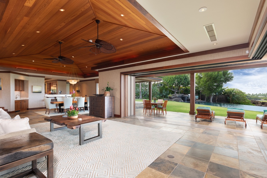 Open-concept great room flows effortlessly to outdoor lounge and poolside seating.