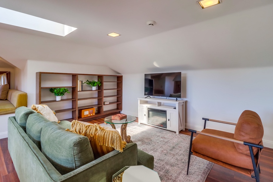 Enjoy cozy movie nights in the family den, complete with a comfortable seating area and a flat-screen TV for your entertainment.