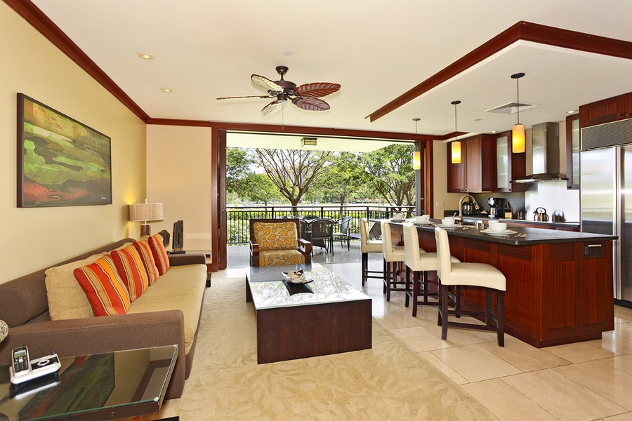 The inviting living area and kitchen with bar seating.