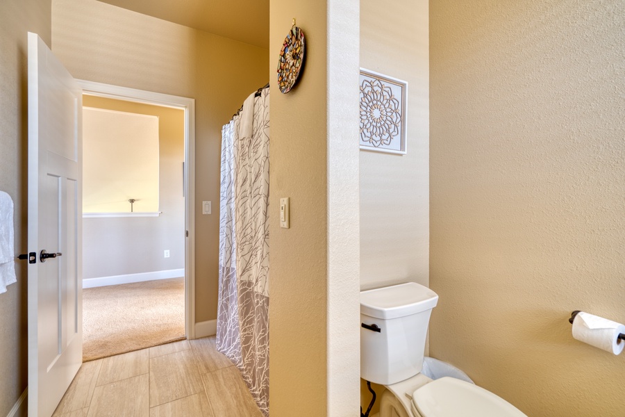 For those staying on the second level, this bathroom is thoughtfully designed to offer privacy and comfort