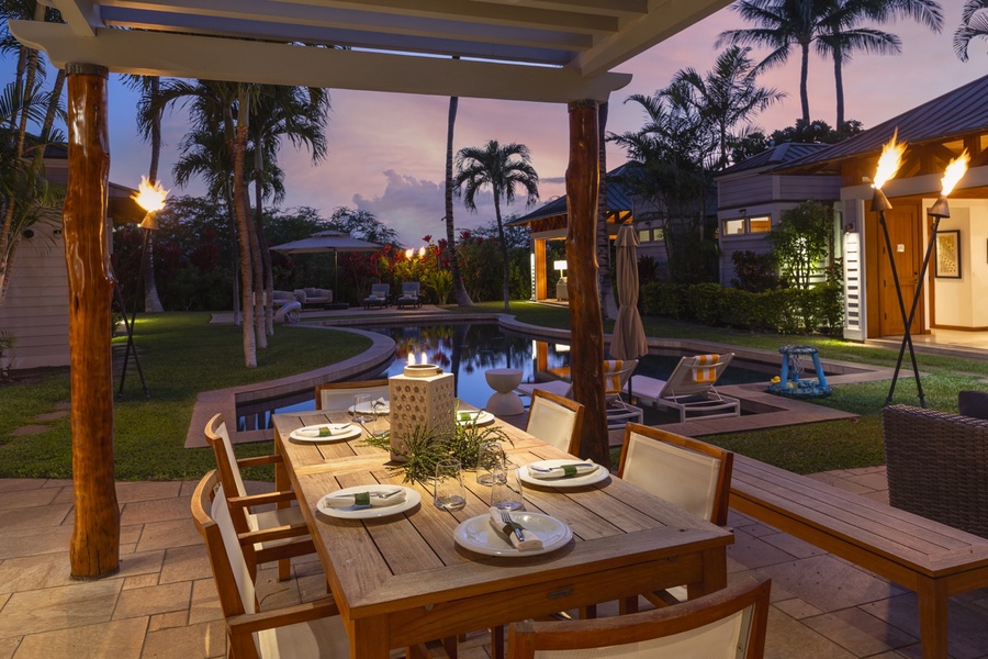 Delightful meals await under the pergola as you watch friends and family swim.