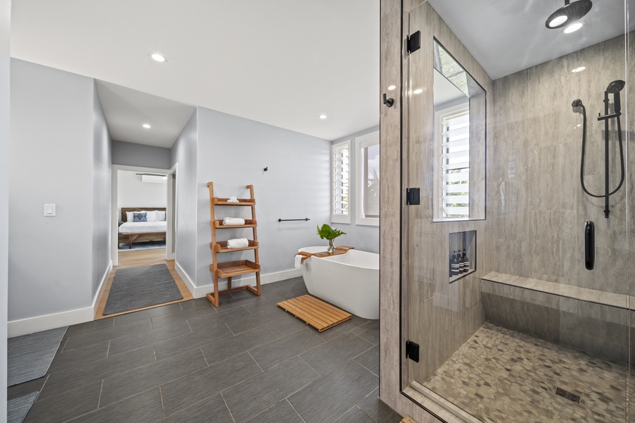 Primary bath with dual vanity sinks and separate lavatory.