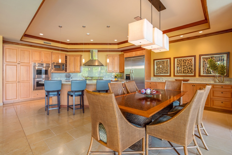 Gourmet Kitchen overlooks Dining Room with seating for the whole family
