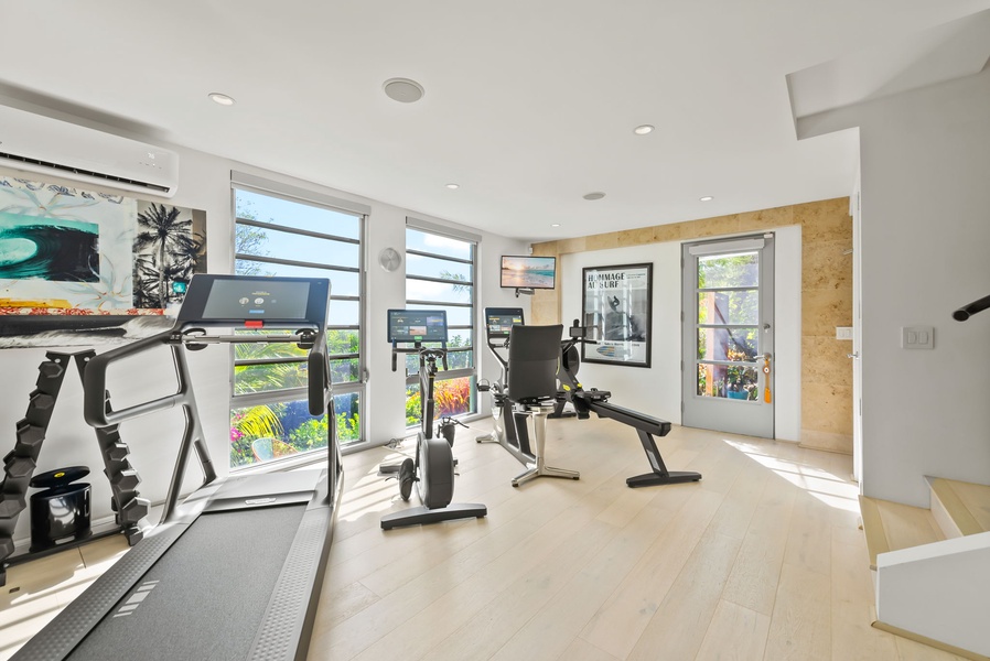 The fully equipped TechnoGym offers floor-to-ceiling windows and indoor-outdoor energy.