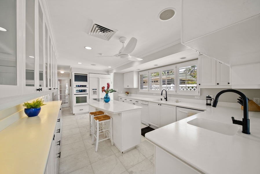 A spacious kitchen with top of the line appliances is a chef's delight.