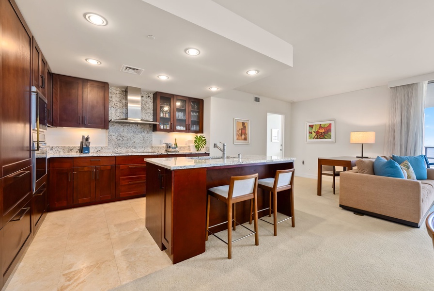 Sleek kitchen with a spacious island, perfect for casual dining.