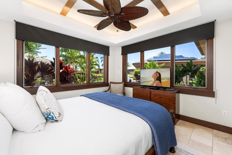 Tranquil guest bedroom with elegant touches and tropical surroundings.