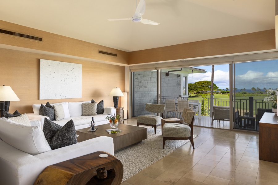 The elegant great room extends out to the covered lanai with dining for six