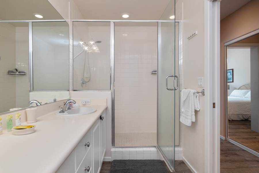 Modern full bath with spacious walk-in shower and double vanity for added convenience.