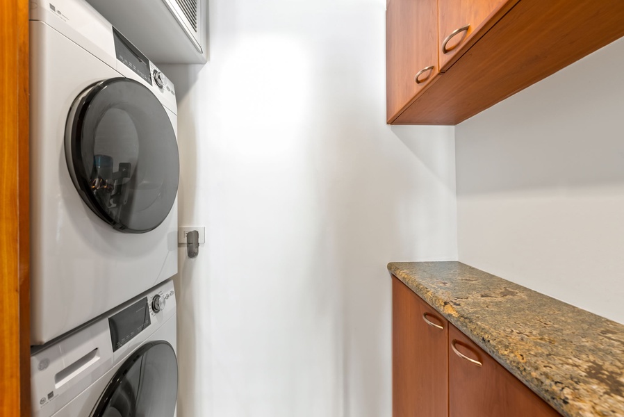 In-suite washer and dryer with countertop space—convenient for keeping clothes fresh during your stay