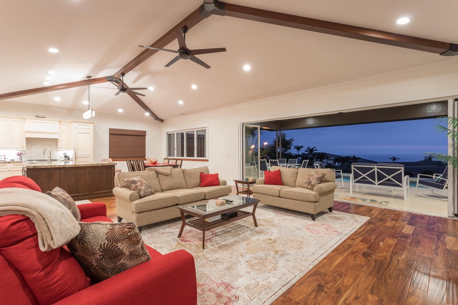 As you enter, you'll be greeted by the open floor plan with 12-14ft vaulted ceilings, a modern updated design, and beautiful hardwood floors with natural travertine stone throughout the home