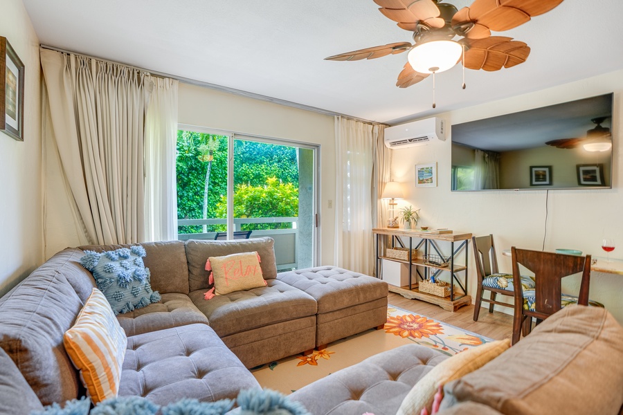 Cozy living area with large sectional and flat screen tv