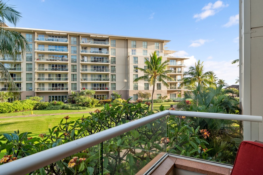 Lush views from Honua Kai Konea 204’s lanai create a tranquil retreat perfect for morning reflection.