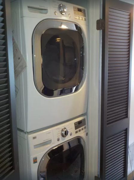 High-efficiency stacked washer/dryer unit keeps beachwear fresh during extended stays.