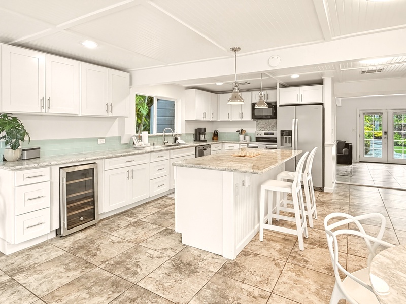 Your spacious gourmet kitchen awaits with granite countertops, stainless appliances, and a perfect island for morning coffee or evening conversations.