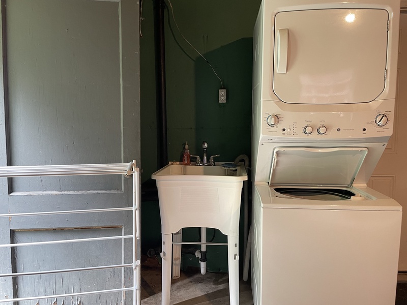 Laundry room in the garage with washer and dryer