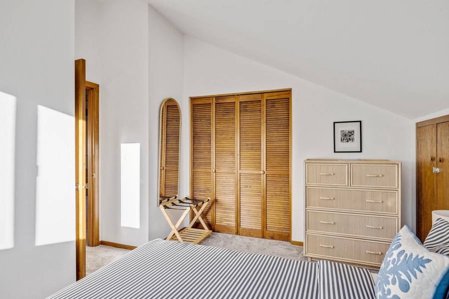 With a wooden closet to keep your stay tidy and neat.