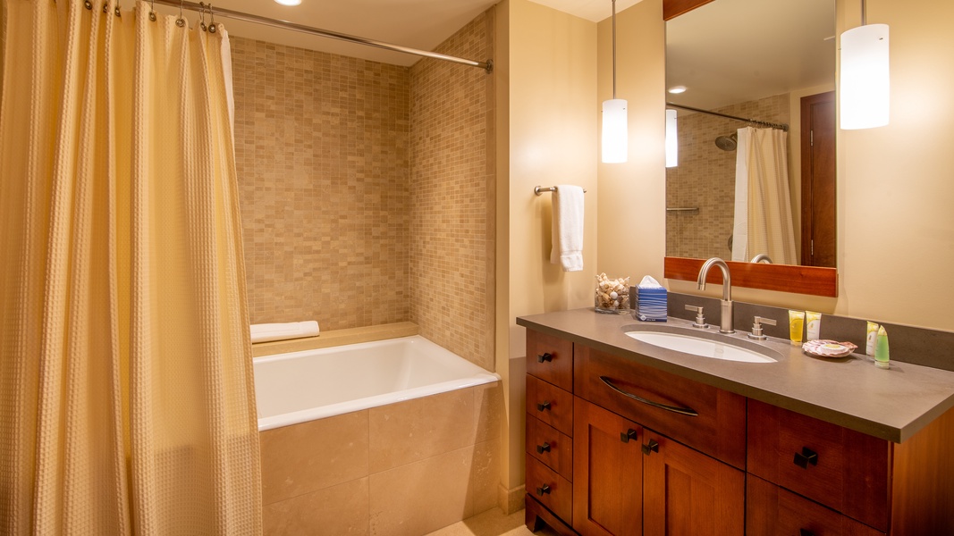 The third guest bathroom has a soaking tub.