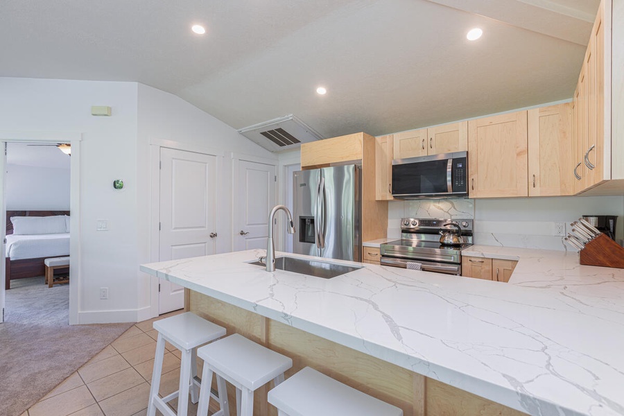 Open kitchen featuring a breakfast bar, good for 4.