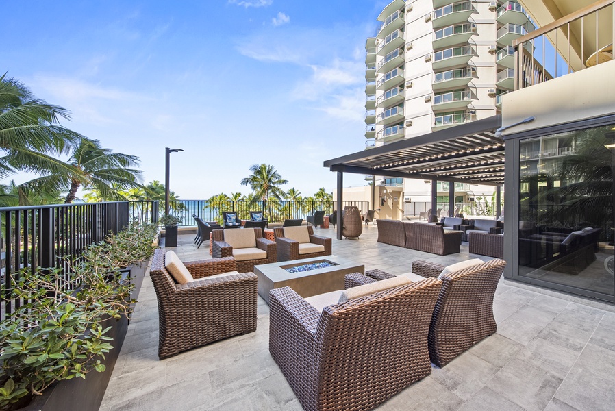 Lounge in comfort on the rooftop terrace, featuring cozy seating and ocean breezes.