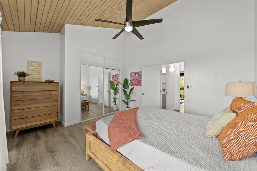 The guest bedroom has a large mirror closet.