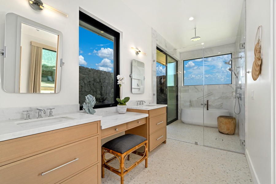 Unwind in your spa-like bathroom with quaretz finishes, rainfall shower, and stunning mountain views through floor-to-ceiling windows.
