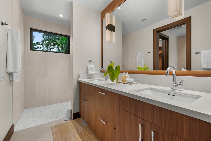 Guest Bedroom #4: Indulge in your private bathroom featuring dual vanities and modern fixtures.